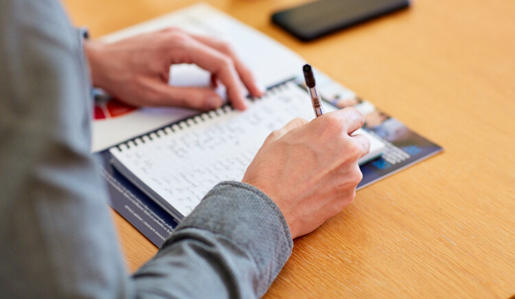 Hand writing in a notebook